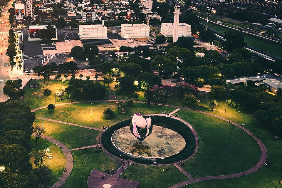 Aerial view of the Floralis Genérica and the city at sunset