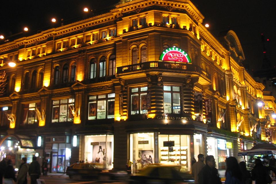 Illuminated facade of Galerías Pacífico at night