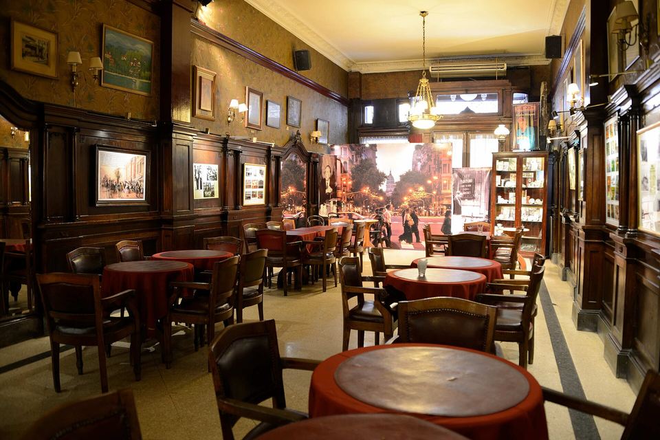 Main room of Café Tortoni with its marble tables